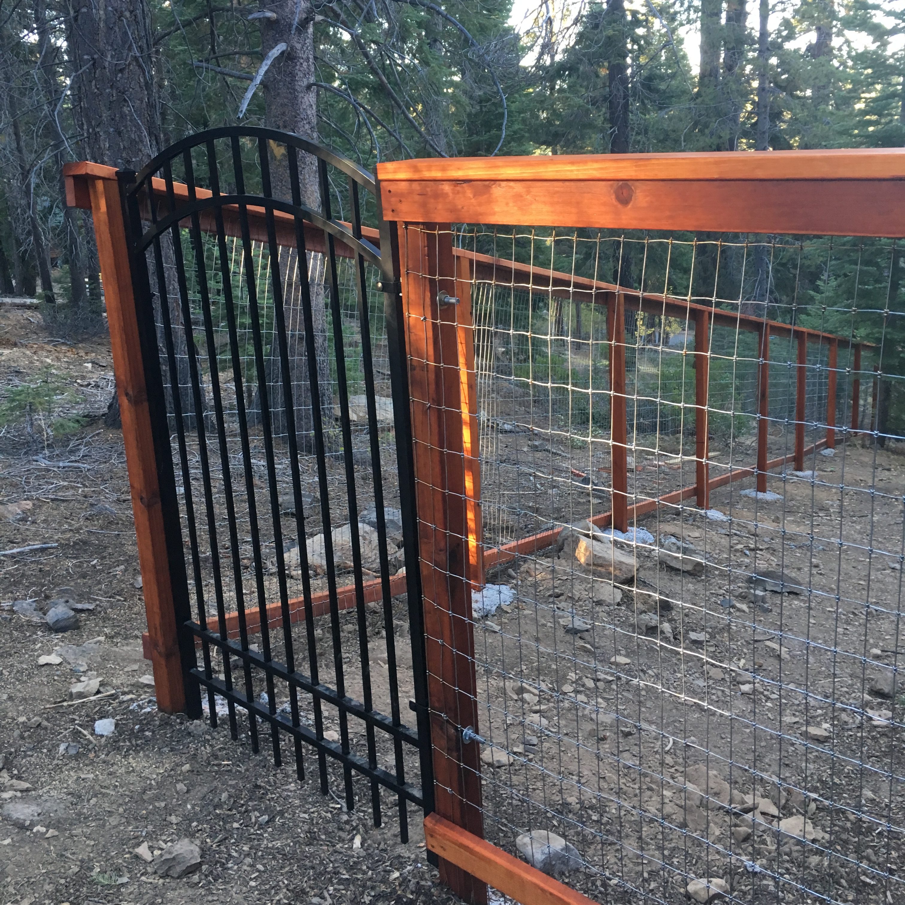 6-foot open-wire fence with metal gate